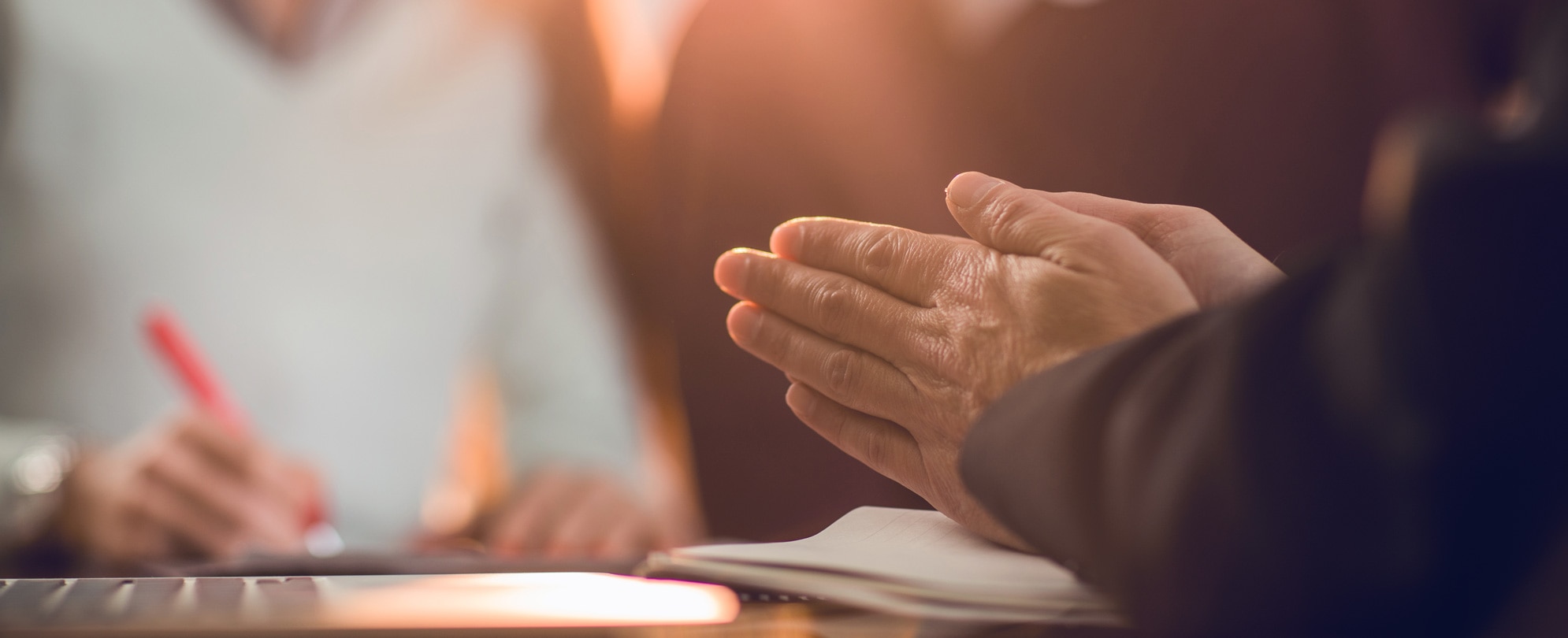 Close up of unrecognizable financial advisor rubbing his hands while made a fraud on his clients