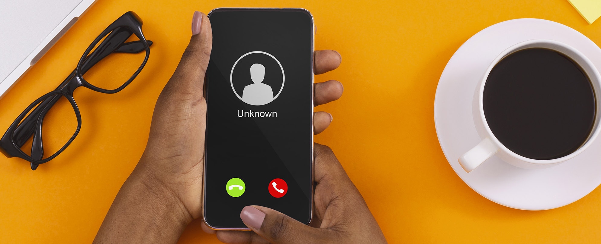 Close up of woman's hands with a smartphone and unknown incoming phone call on it