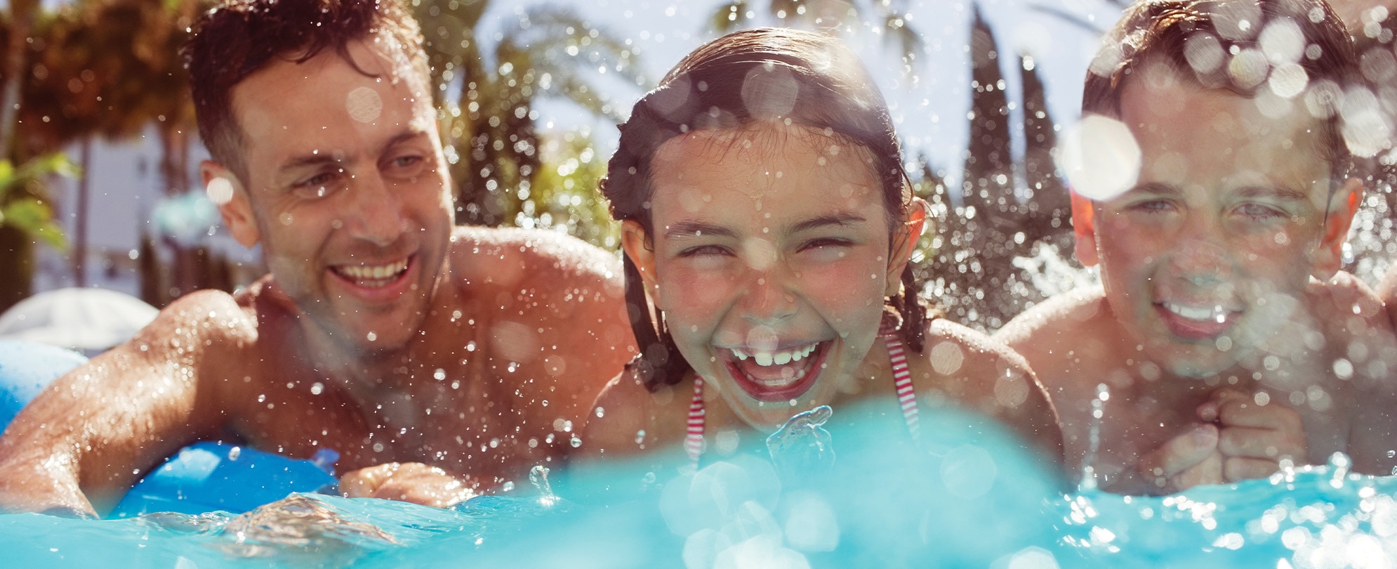 family enjoying a swimming pool