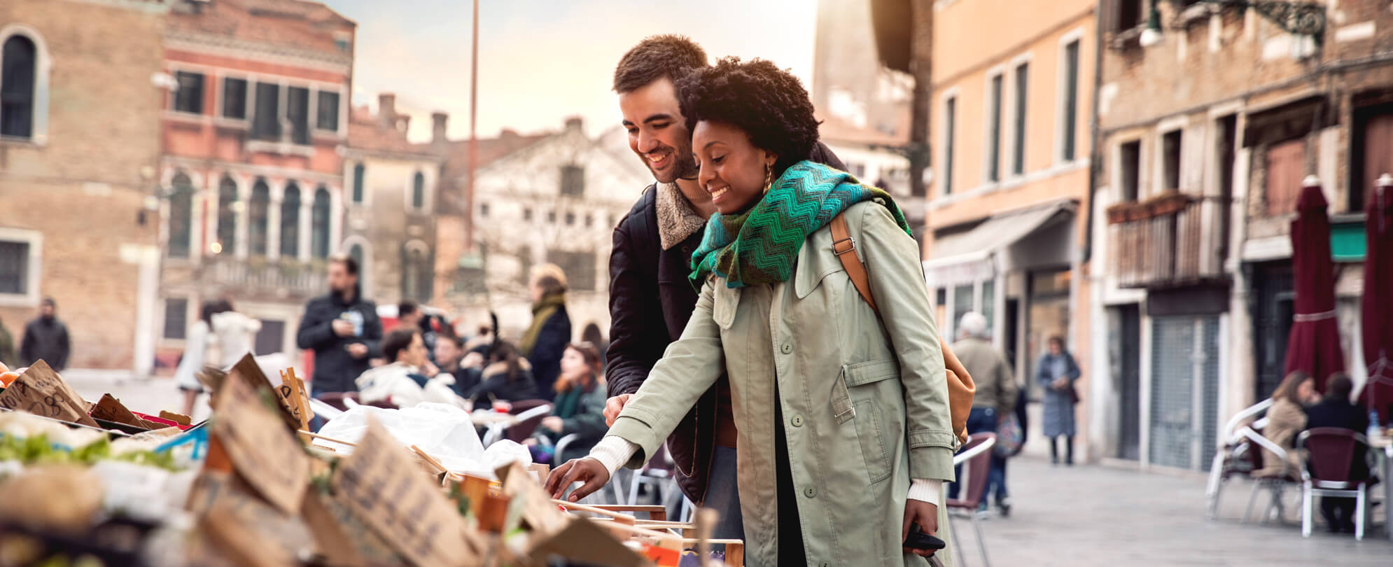 Couple exploring local markets on vacation 