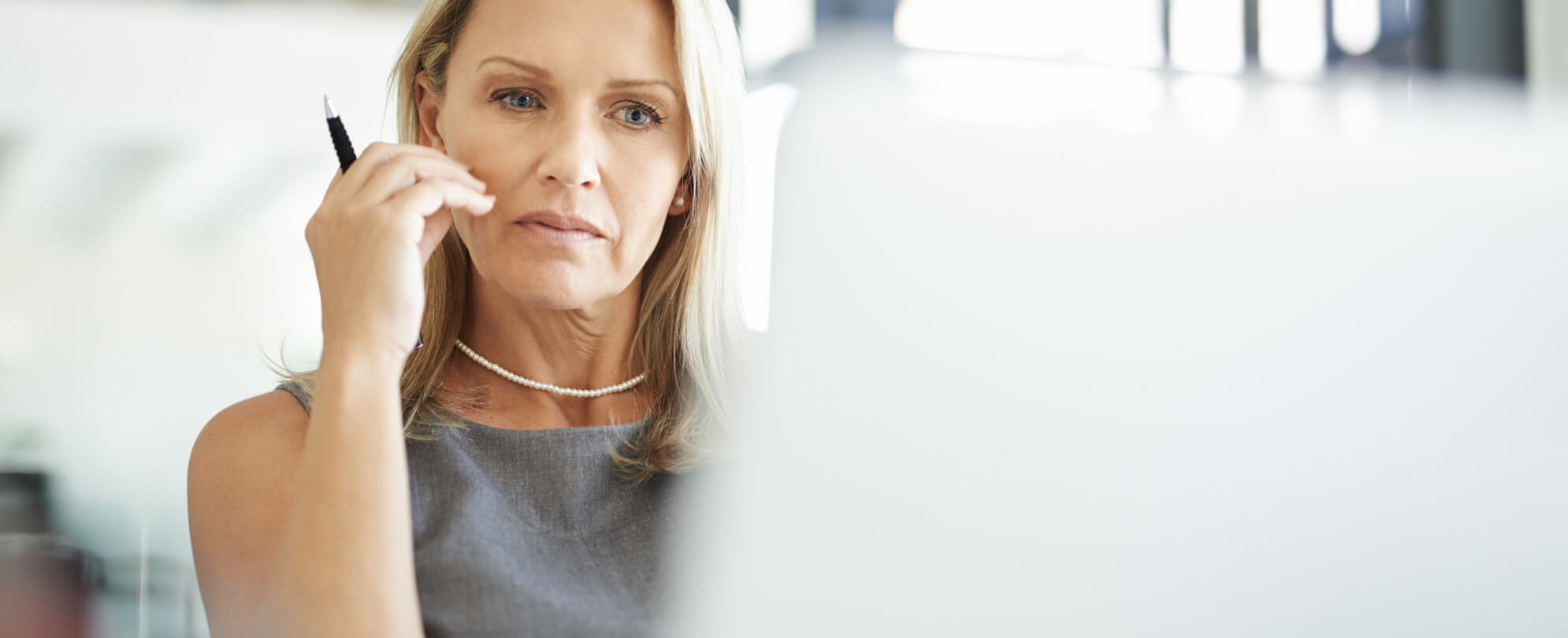 Concerned Mature Businesswoman Looking At Laptop Screen Sitting Touching Face