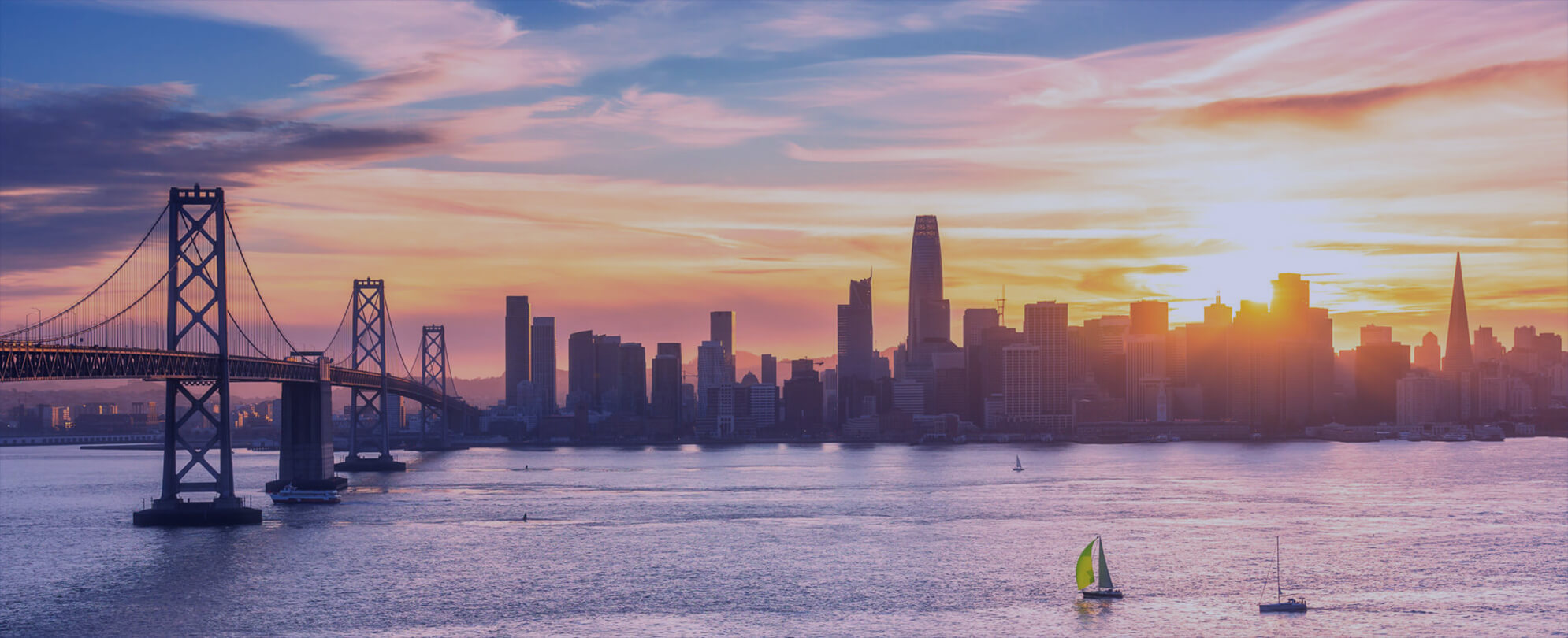 City skyline over the water at sunset 