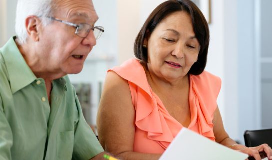 Senior couple reviewing important paperwork 