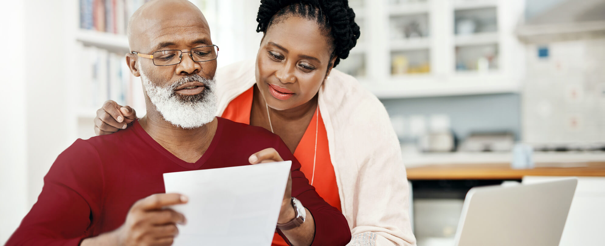 African American couple looking over important timeshare document 