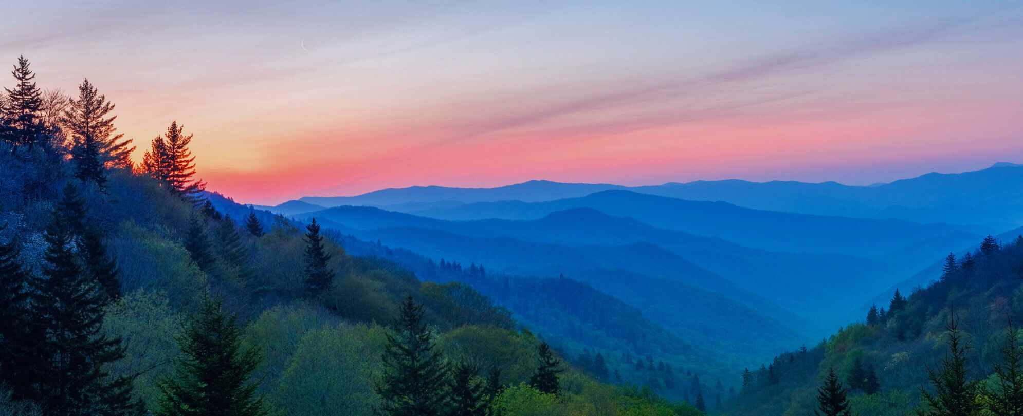 Bird's eye view of lush mountainscape at sunrise 